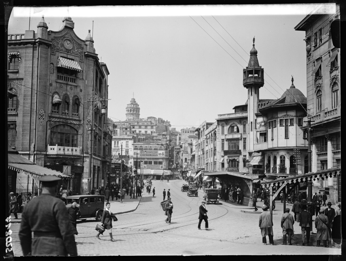 A lively view of Karakoy Street, featuring a mix of Ottoman and early Republican architecture with Galata Tower in the background, Istanbul, Türkiye, May 1928. (Photo via Eski Istanbul)