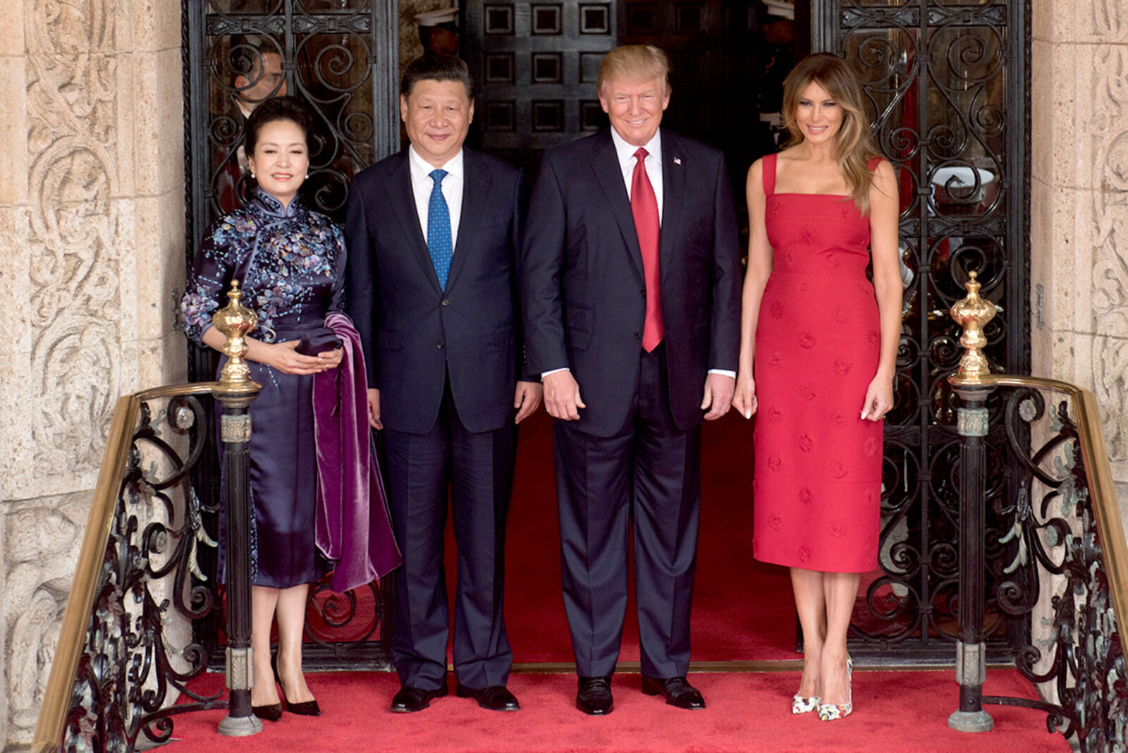 Former U.S. President Donald Trump (C-R) and Melania Trump (R) pose for a photo with Chinese President Xi Jinping (C-L) and his wife Mrs. Peng Liyuan, at the entrance of Mar-a-Lago in Palm Beach, Florida, U.S., April 6, 2017. (Photo via D. Myles Cullen)