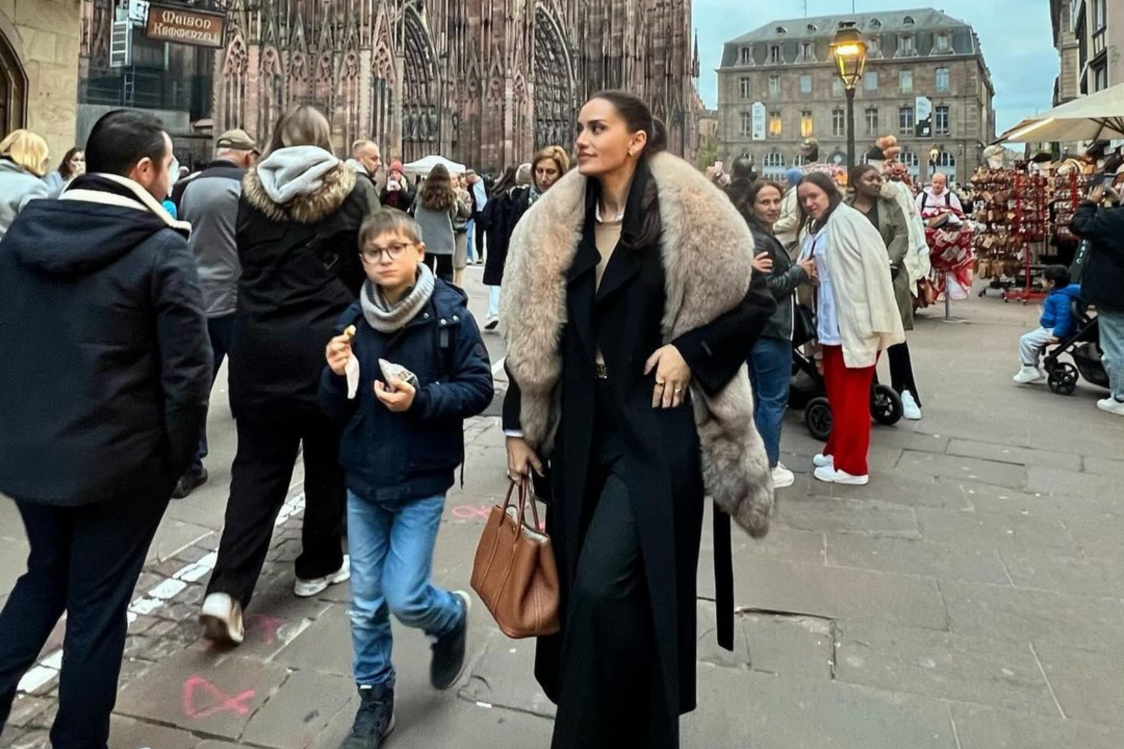 Fahriye Evcen walks through the streets wearing a cream-colored fur coat, drawing criticism on social media, Strasbourg, France, Nov. 4, 2024. (Photo via Instagram / @evcenf)