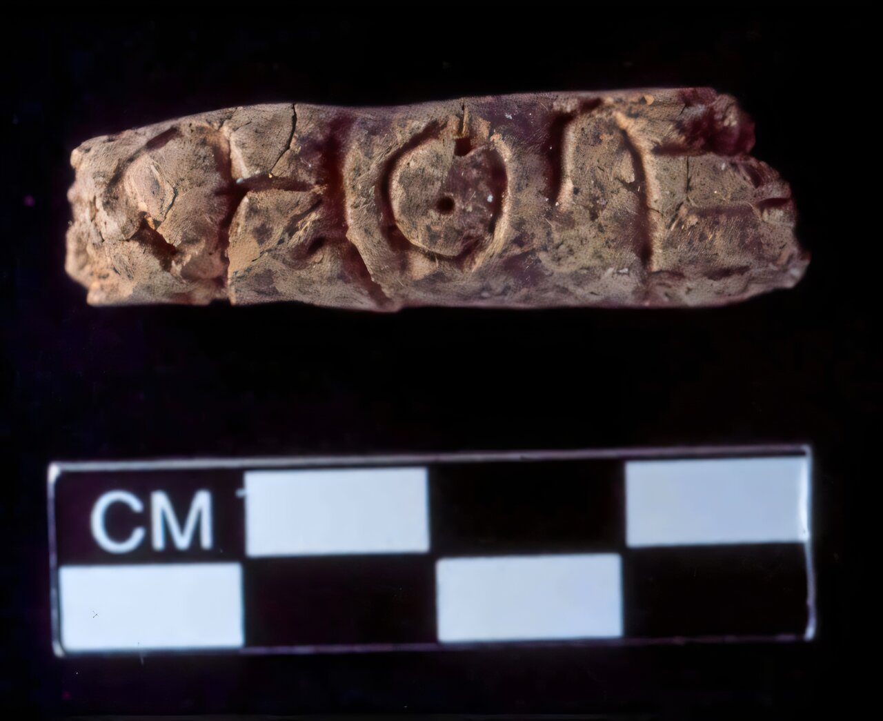 Clay objects roughly the size of fingers were discovered during a dig at the ancient city of Umm el-Marra. The engraved symbols may be part of the earliest known alphabet. (Photo via Glenn Schwartz/ Johns Hopkins University)