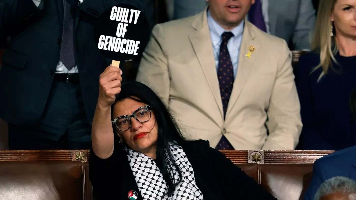 Congresswoman Rashida Tlaib holds a sign reading 'Guilty of Genocide' as Israeli Prime Minister Benjamin Netanyahu addresses joint session of Congress in Washington DC, on July 24, 2024 (AFP Photo)