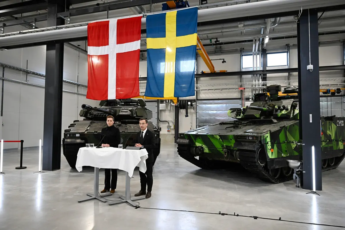 Swedish Prime Minister Ulf Kristersson and Danish Prime Minister Mette Frederiksen during a visit to defence company BAE Systems Hägglunds in Örnsköldsvik, Sweden in May 2024. (Courtesy of The Local)