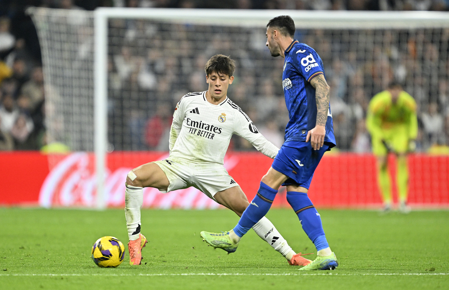 Arda Guler (L) of Real Madrid in action against Diego Rico (R) of Getafe during the La Liga week 15th match against Getafe, Madrid, Spain on December 1, 2024. (AA Photo)