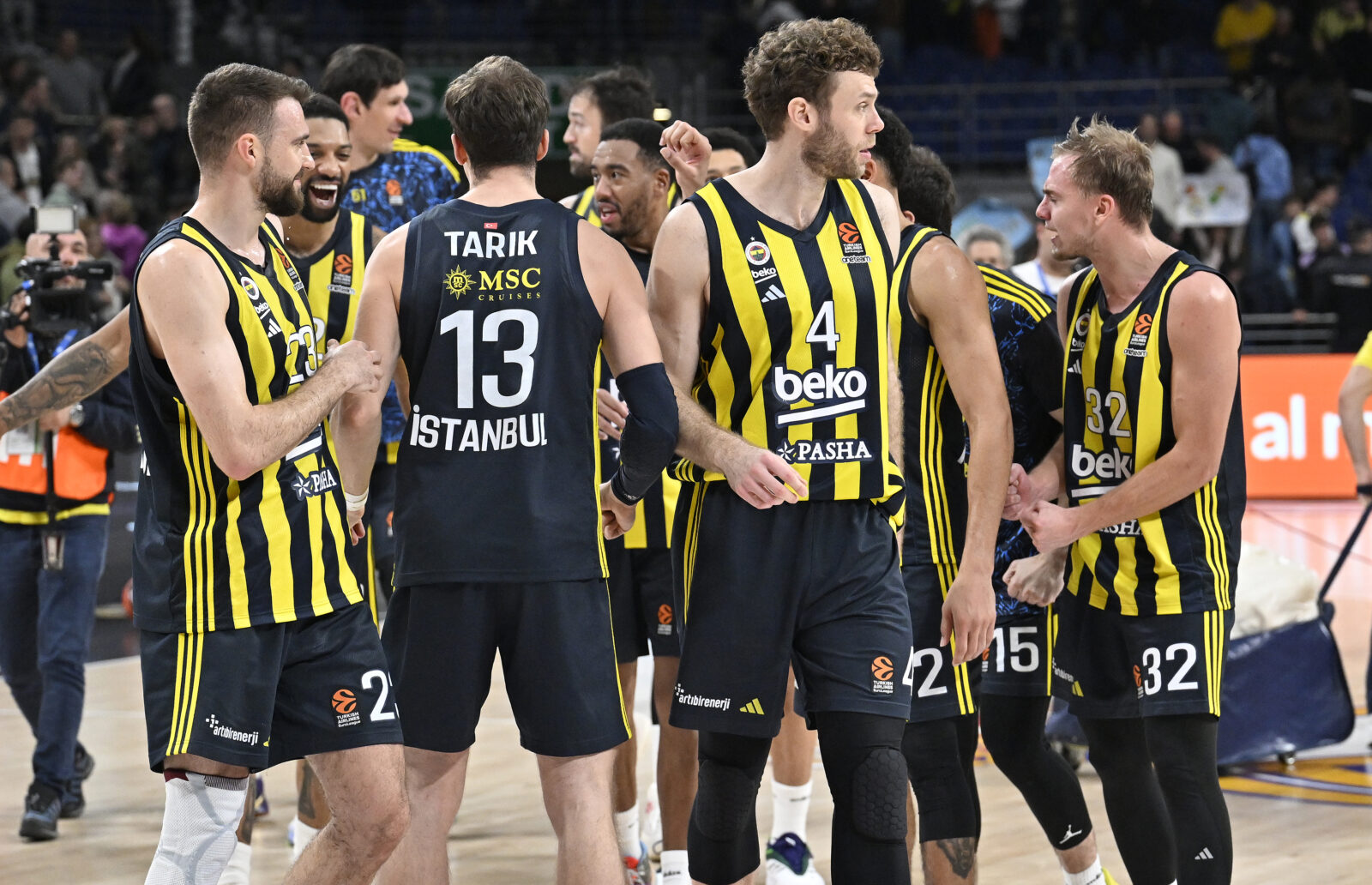 Players of Fenerbahce Beko celebrate their victory after the Turkish Airlines EuroLeague week 14 basketball match against Real Madrid in Madrid, Spain, Dec. 5, 2024. (AA Photo)