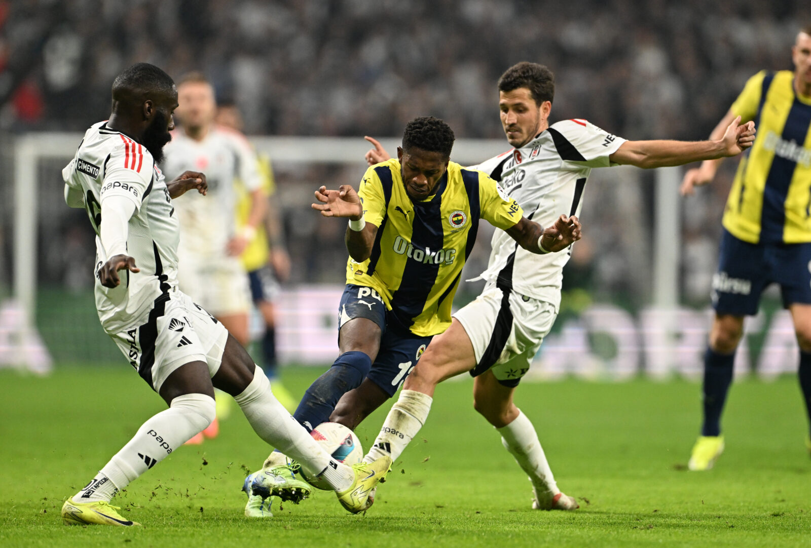 Salih Ucan (R) of Besiktas in action against Fred (C) of Fenerbahce during the Turkish Super Lig week 15 football match between Besiktas and Fenerbahce at Tupras Stadium in Istanbul, Türkiye, December 7, 2024. (AA Photo)