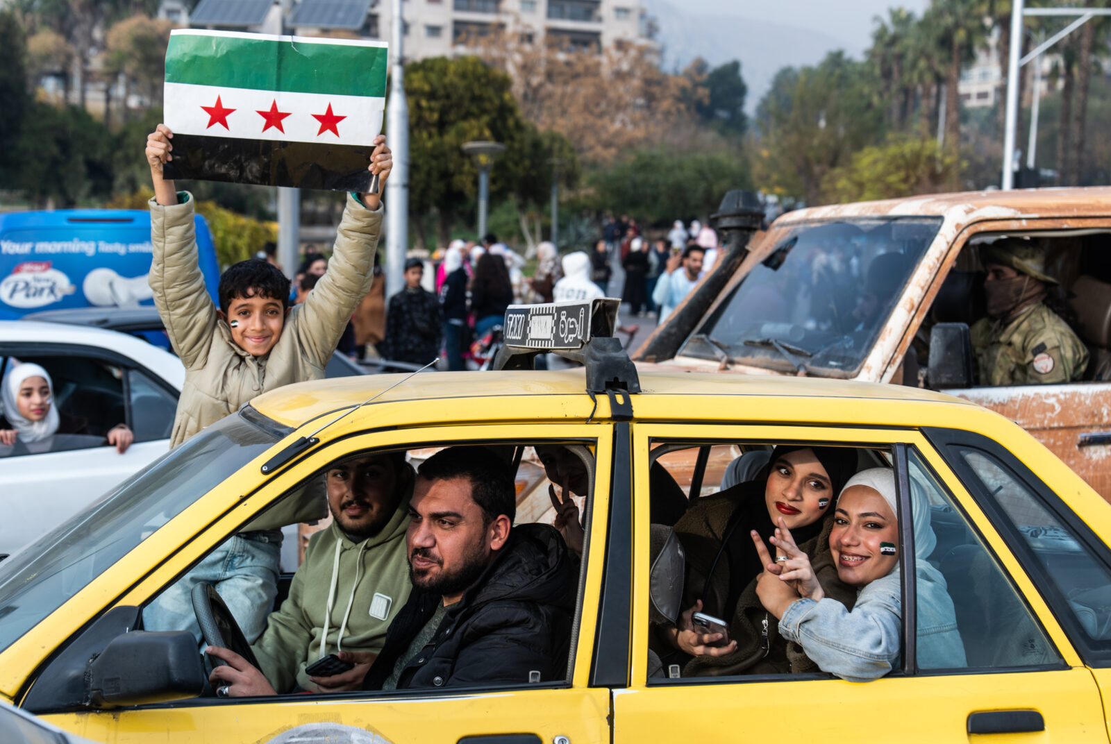 Syrians waving flags gather at Umayyad Square to celebrate the collapse of the 61-year Baath regime, in Damascus, Syria on December 11, 2024. (AA Photo)<img src=