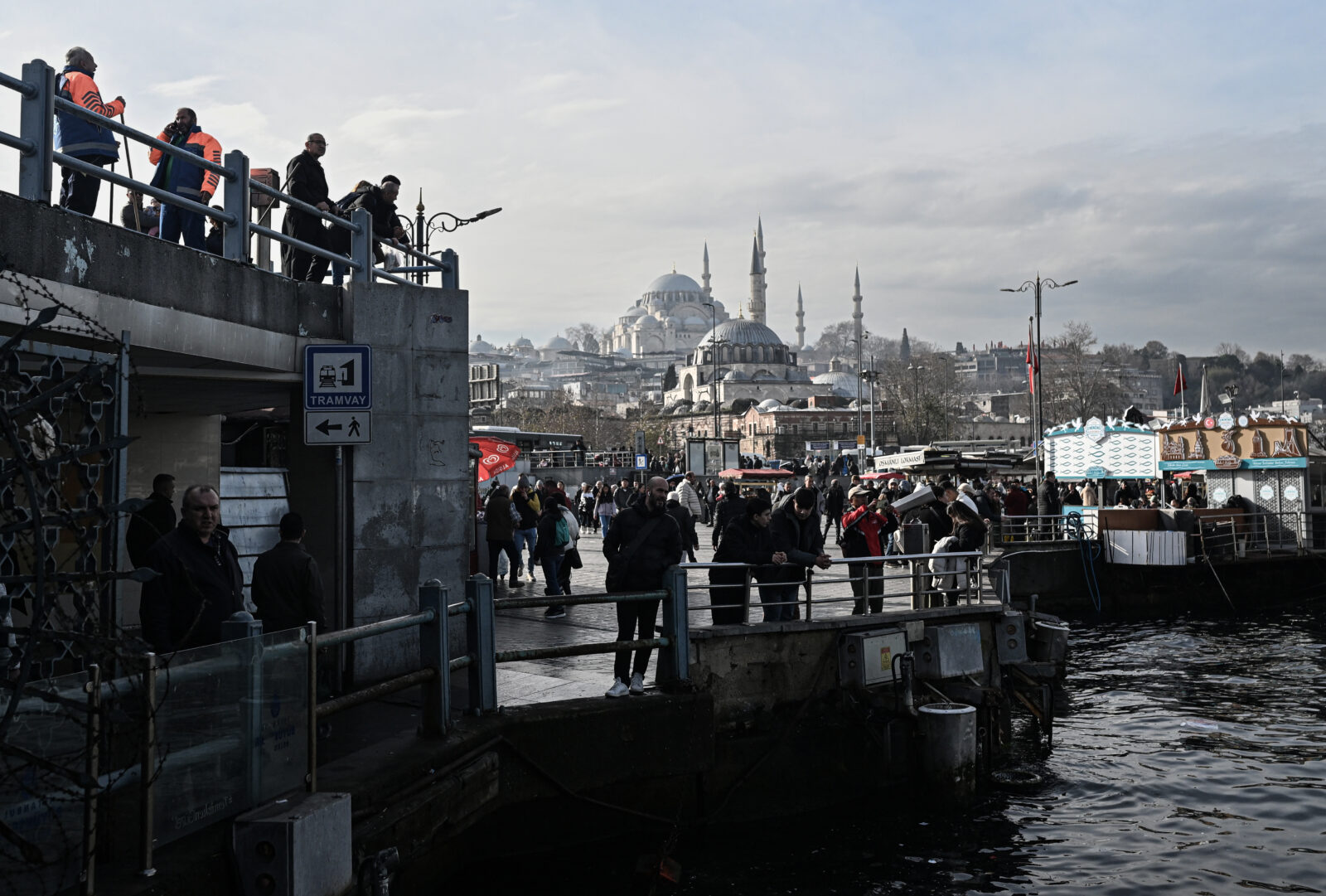 People spend time around the Eminonu during a sunny day in Istanbul, Türkiye on Dec. 25, 2024. (AA Photo)