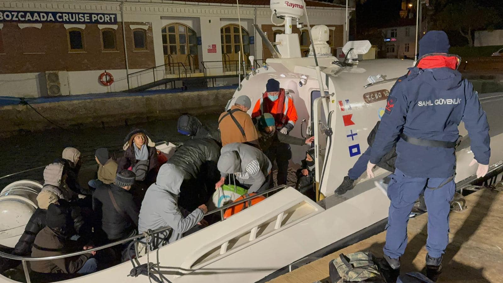 Coast Guard teams intercept 45 irregular migrants in a rubber boat off Bozcaada, Canakkale. Migrants are brought ashore and handed over to the Ayvacik Migrant Reception and Transfer Center after processing (AA Photo)