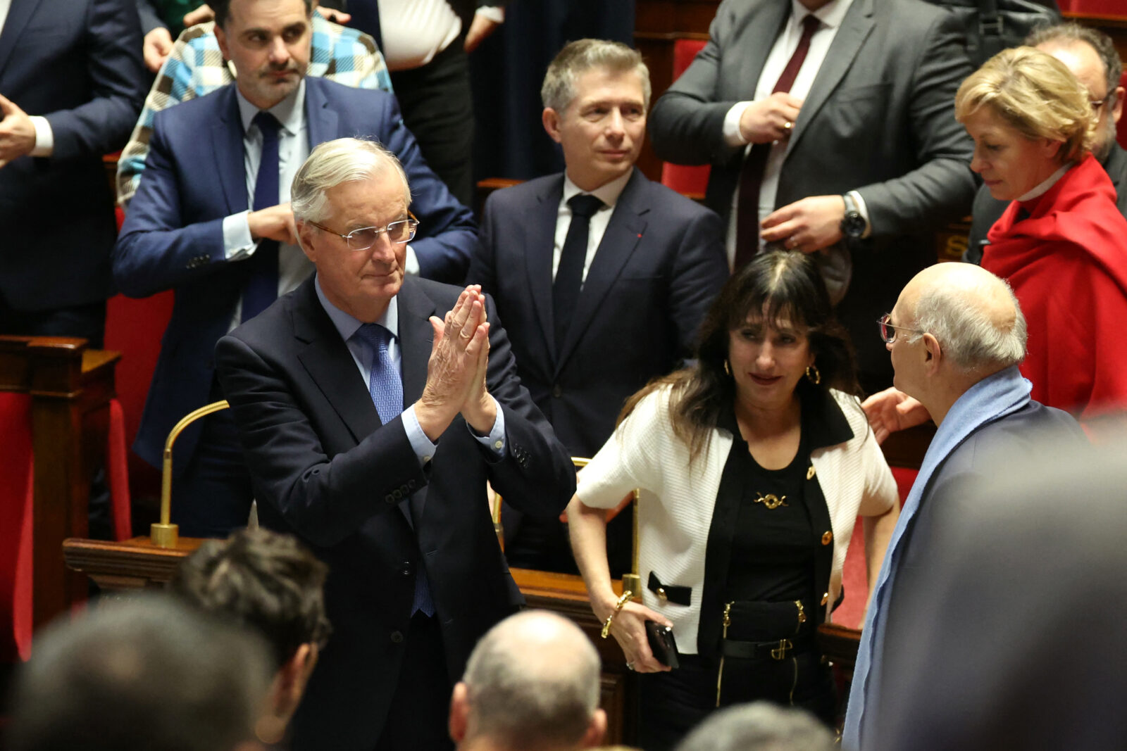 French Prime Minister Michel Barnier gestures after the result of the no-confidence vote on his administration at the National Assembly in Paris on December 4, 2024 as French MPs voted to oust his government after just three months in office in a move which deepens a political crisis in the country. - The French National Assembly was voting two motions brought by the French left-wing Nouveau Front Populaire (New Popular Front) NFP coalition and the French far-right Rassemblement National (National Rally) RN party in a standoff over 2025's austerity budget, which saw French Prime Minister force through a social security financing bill without a vote (article 49.3) on December 2, 2024. (Photo by ALAIN JOCARD / AFP)<img src=