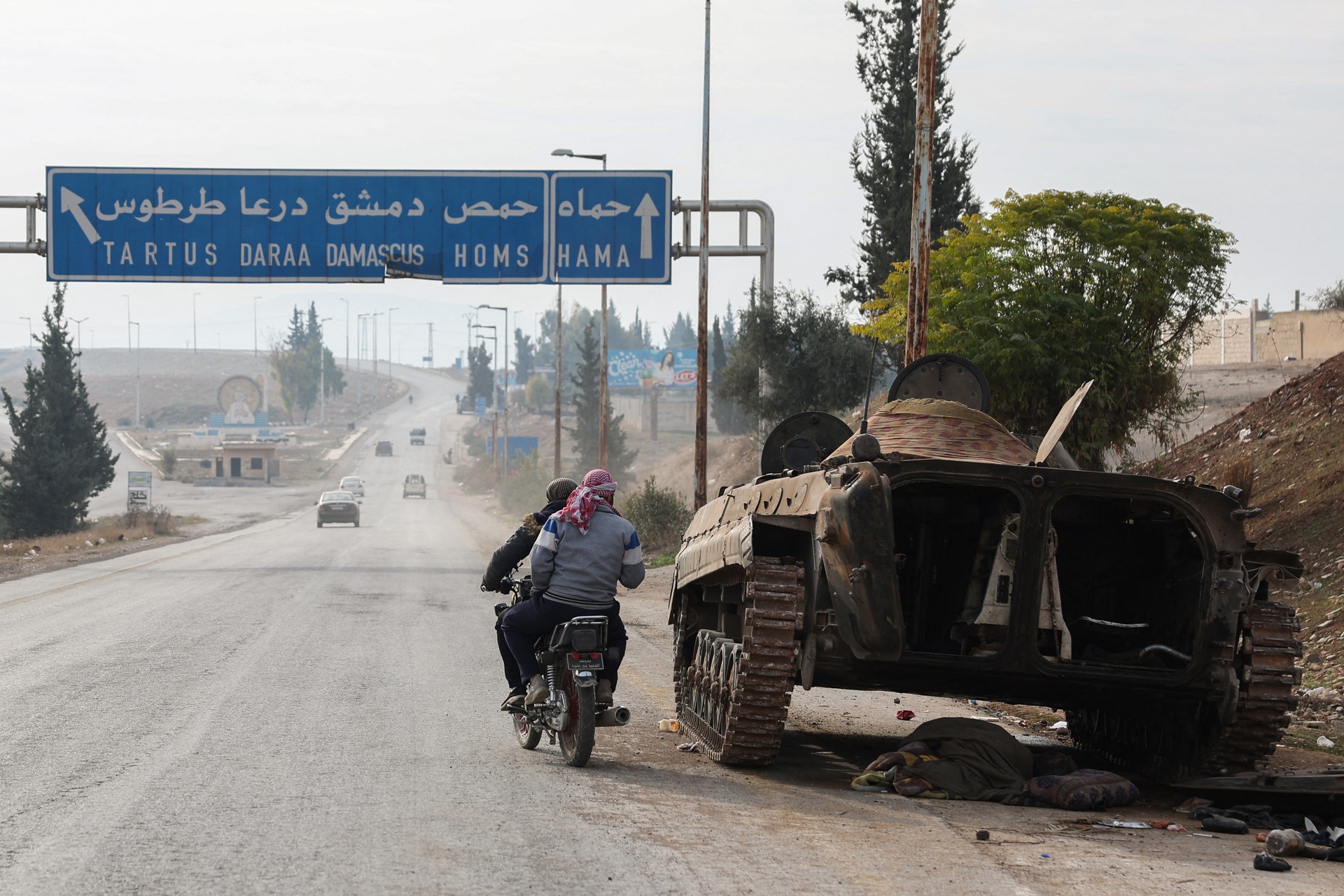 Homs falls to anti-regime forces amid uncertainty over Assad's whereabouts