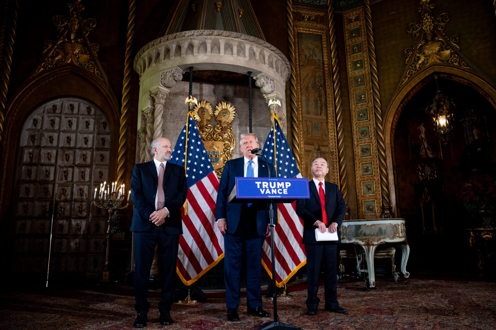 PALM BEACH, FLORIDA - DECEMBER 16: U.S. President-elect Donald Trump, accompanied by SoftBank CEO Masayoshi Son (R) and Trump's choice for Secretary of Commerce, Cantor Fitzgerald Chairman and CEO Howard Lutnick, speaks at a news conference at Trump's Mar-a-Lago resort on December 16, 2024 in Palm Beach, Florida. In a news conference that went over an hour, Trump announced that SoftBank will invest over $100 billion in projects in the United States including 100,000 artificial intelligence related jobs, and then took questions on Syria, Israel, Ukraine, the economy, cabinet picks, and many other topics. Andrew Harnik/Getty Images/AFP (Photo by Andrew Harnik / GETTY IMAGES NORTH AMERICA / Getty Images via AFP)PALM BEACH, FLORIDA - DECEMBER 16: U.S. President-elect Donald Trump delivers remarks alongside SoftBank CEO Masayoshi Son (R) and Trump's choice for Secretary of Commerce, Cantor Fitzgerald Chairman and CEO Howard Lutnick at Trump?s Mar-a-Lago resort on December 16, 2024 in Palm Beach, Florida. Trump announced that SoftBank will invest over $100 billion in projects in the United States including 100,000 artificial intelligence related jobs. Andrew Harnik/Getty Images/AFP (Photo by Andrew Harnik / GETTY IMAGES NORTH AMERICA / Getty Images via AFP)U.S. President-elect Donald Trump, accompanied by SoftBank CEO Masayoshi Son (R) and Trump's choice for Secretary of Commerce Cantor Fitzgerald, Chairman and CEO Howard Lutnick, speaks at a news conference at Trump's Mar-a-Lago resort in Palm Beach, Florida, U.S, on Dec. 16, 2024. (AFP Photo)
