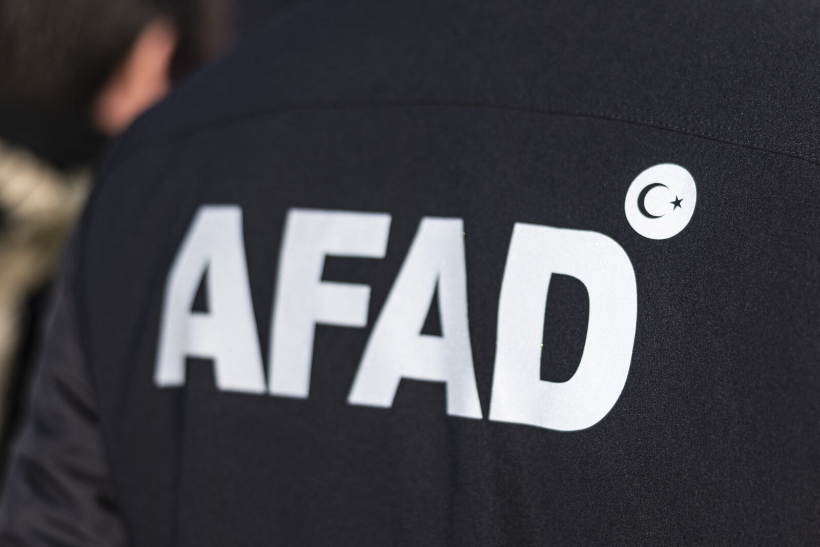 The logo of the Turkish Disaster and Emergency Management Presidency (AFAD) is pictured on the back of a member during a search for prisoners at the Sednaya prison, on Dec. 16, 2024. (AFP Photo)