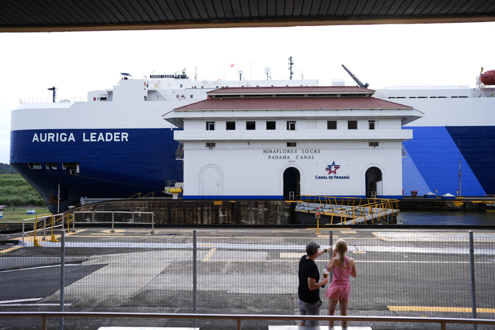 Tourists look at the Miraflores Locks of the Panama Canal in Panama City on December 23, 2024. - US President-elect Donald Trump has threatened to demand control of the Panama Canal be returned to Washington, complaining of