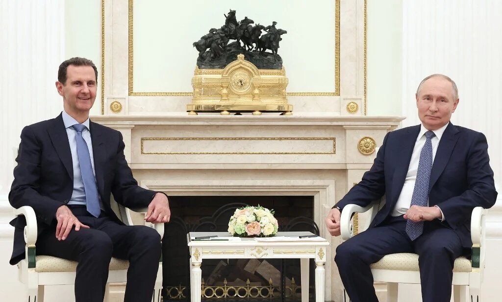 In this pool photograph distributed by the Russian state agency Sputnik on July 25, 2024, Russia's President Vladimir Putin (R) meets with Syria's President Bashar al-Assad at the Kremlin in Moscow on July 24, 2024 (Valery Sharifulin / Pool / AFP)