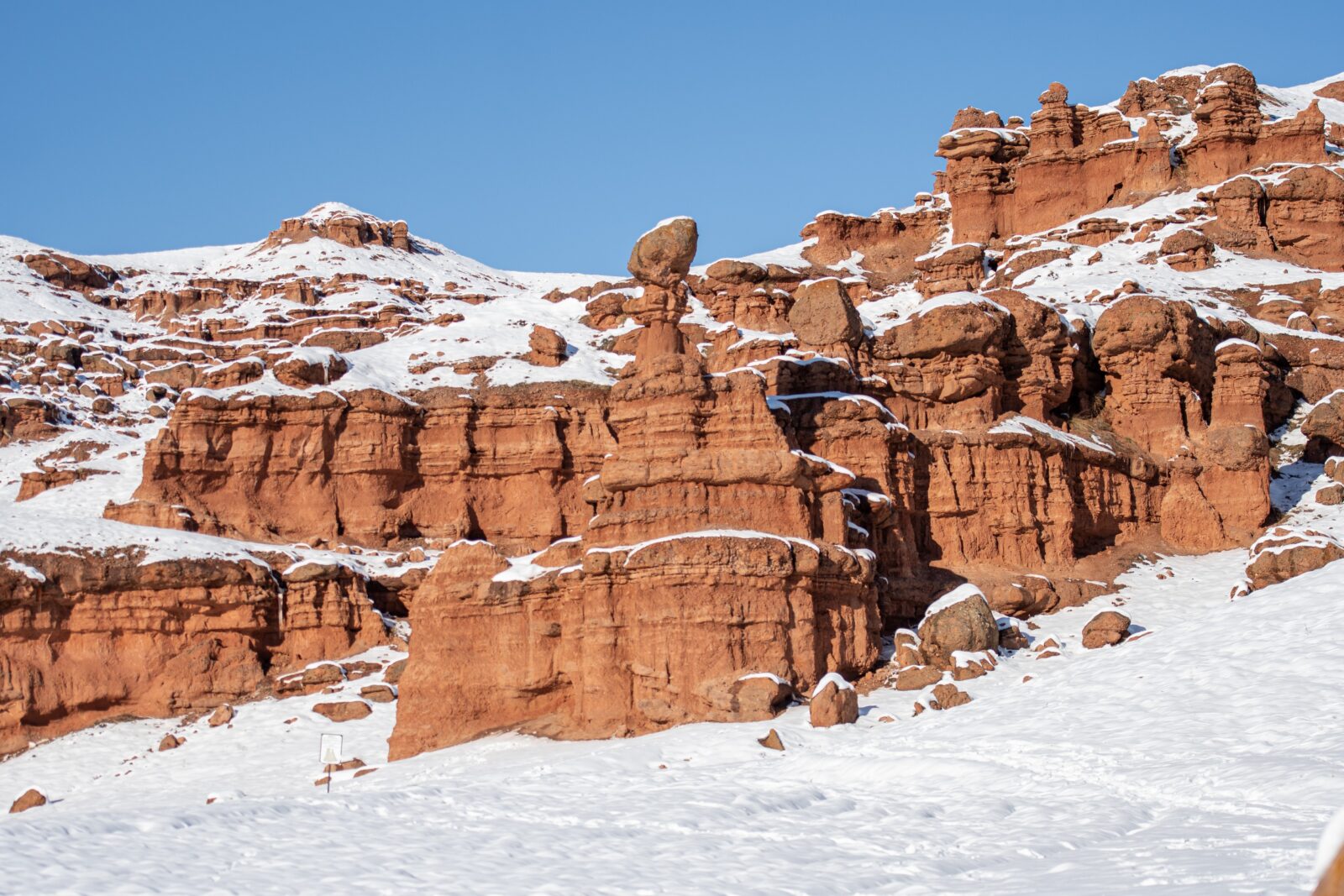 The Narman Fairy Chimneys in Erzurum have turned white with their unique red landscape even during severe weather conditions in winter, Türkiye, Dec. 3, 2024. (IHA Photo)