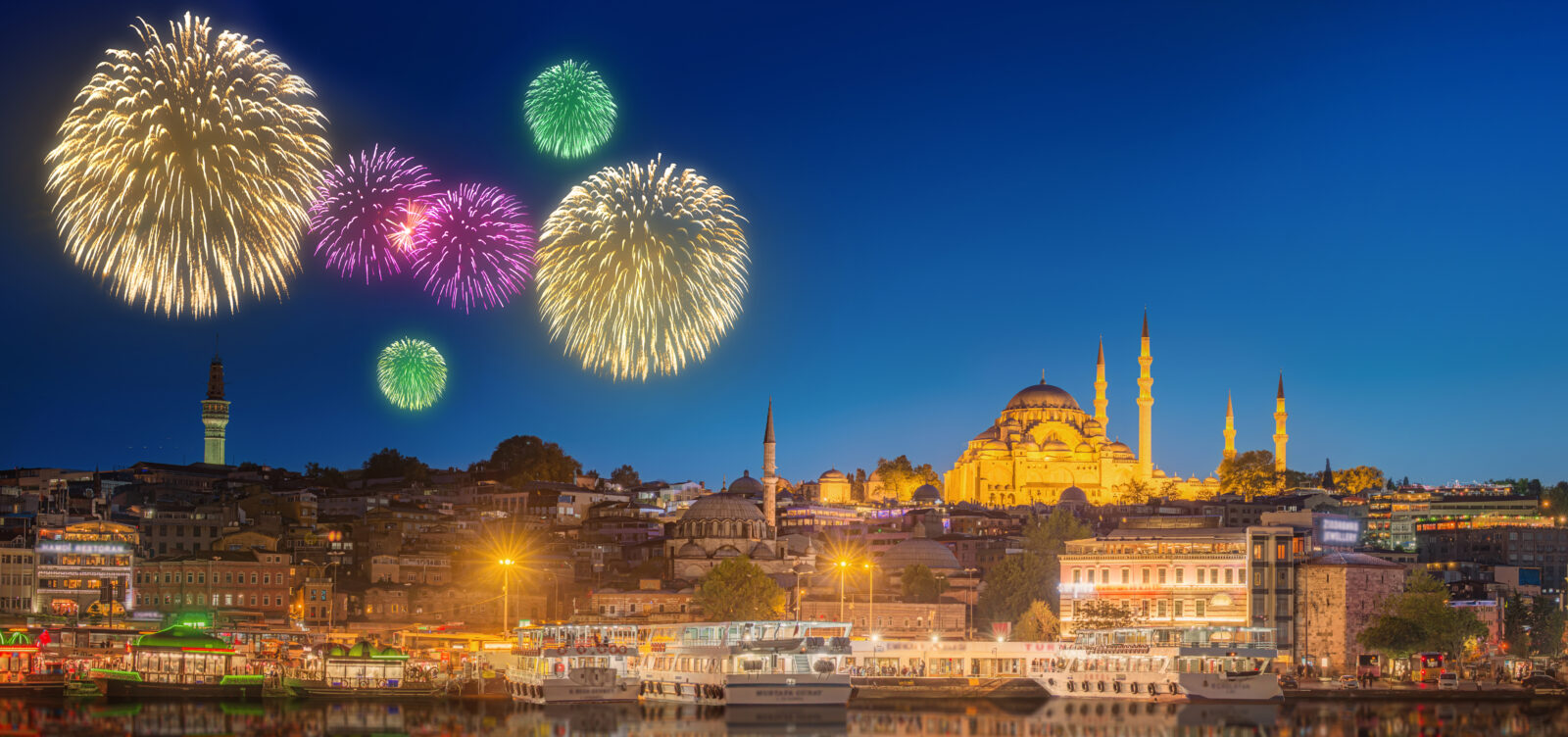 Istanbul's cityscape, including Galata Tower and the Golden Horn, becomes a vibrant display of fireworks during New Year’s Eve celebrations in Türkiye. (Adobe Stock Photo)