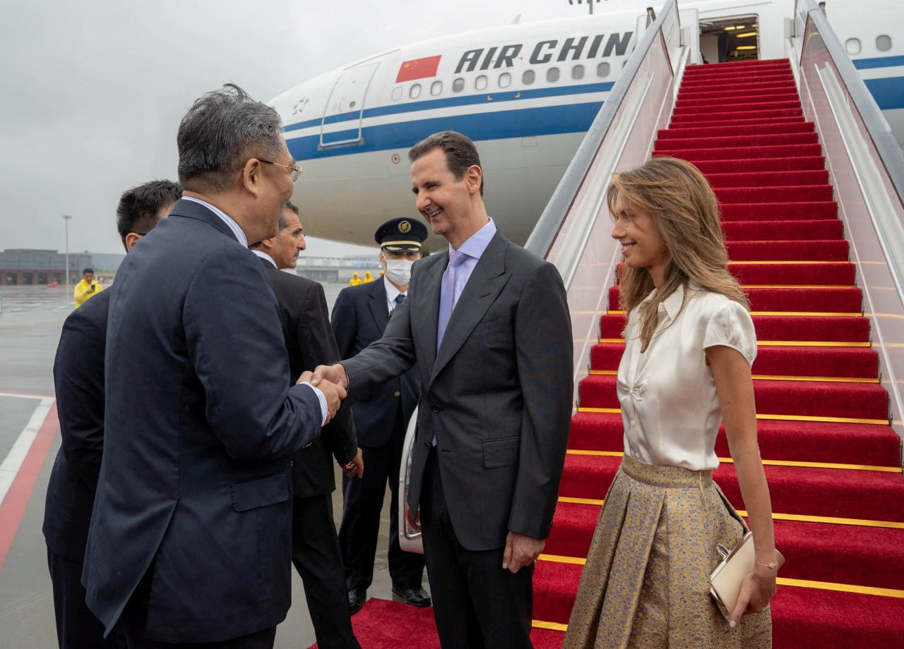 Syria's President Bashar al-Assad and his wife Asma are welcomed upon their arrival at Hangzhou airport, China in this handout picture obtained by Reuters on September 21, 2023. Syrian Presidency/Handout via Reuters