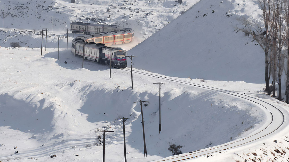 The Touristic Eastern Express (Dogu Ekspresi) travels through snow-covered landscapes on its route between Ankara and Kars, Türkiye, Dec. 19, 2024. (Photo via AA)