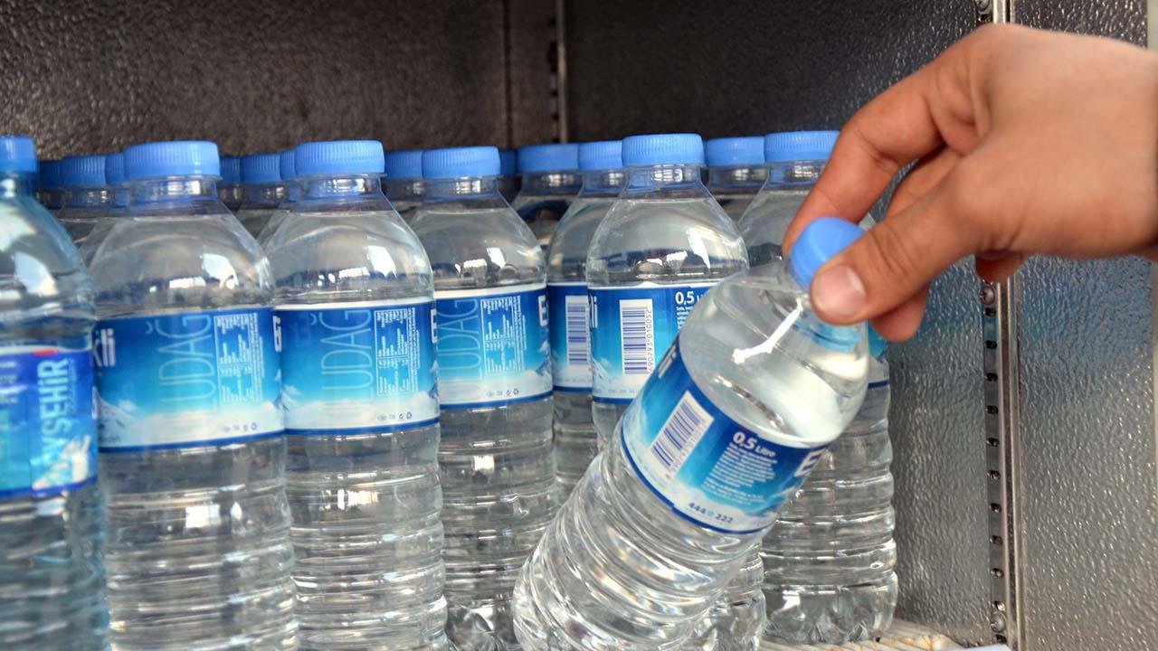 Person is picking a water in a plastic bottle. (AA Photo)