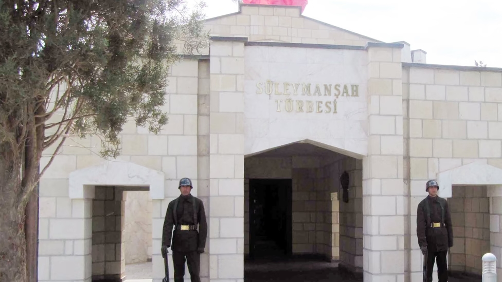 Turkish soldiers stand guard at old Suleyman Shah tomb in Karakozak village, Syria, 2011. (Photo via Wikimedia)