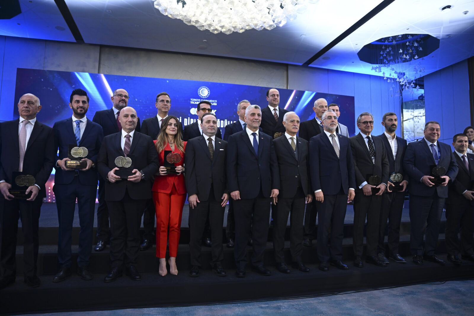 Türkiye's Trade Minister Omer Bolat and Minister of Labor and Social Security Vedat Isikhan attend the 6th Commercial Diplomacy Awards Ceremony organized by the Foreign Economic Relations Board (DEIK) at a hotel in Istanbul, and along with DEIK President Nail Olpak, pose for a group photo with representatives of business councils recognized with awards in Istanbul, Türkiye, on Jan. 10, 2024. (AA Photo)