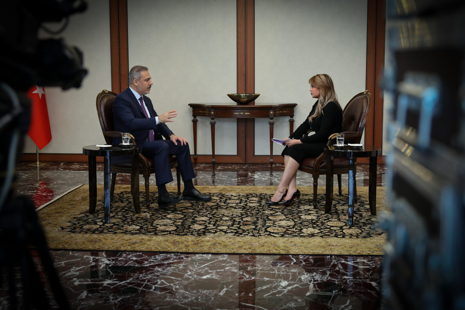 Turkish Foreign Minister Hakan Fidan (L) speaks during an interview with Asharq News in the Turkish capital Ankara, Jan. 25, 2025. (AA Photo)
