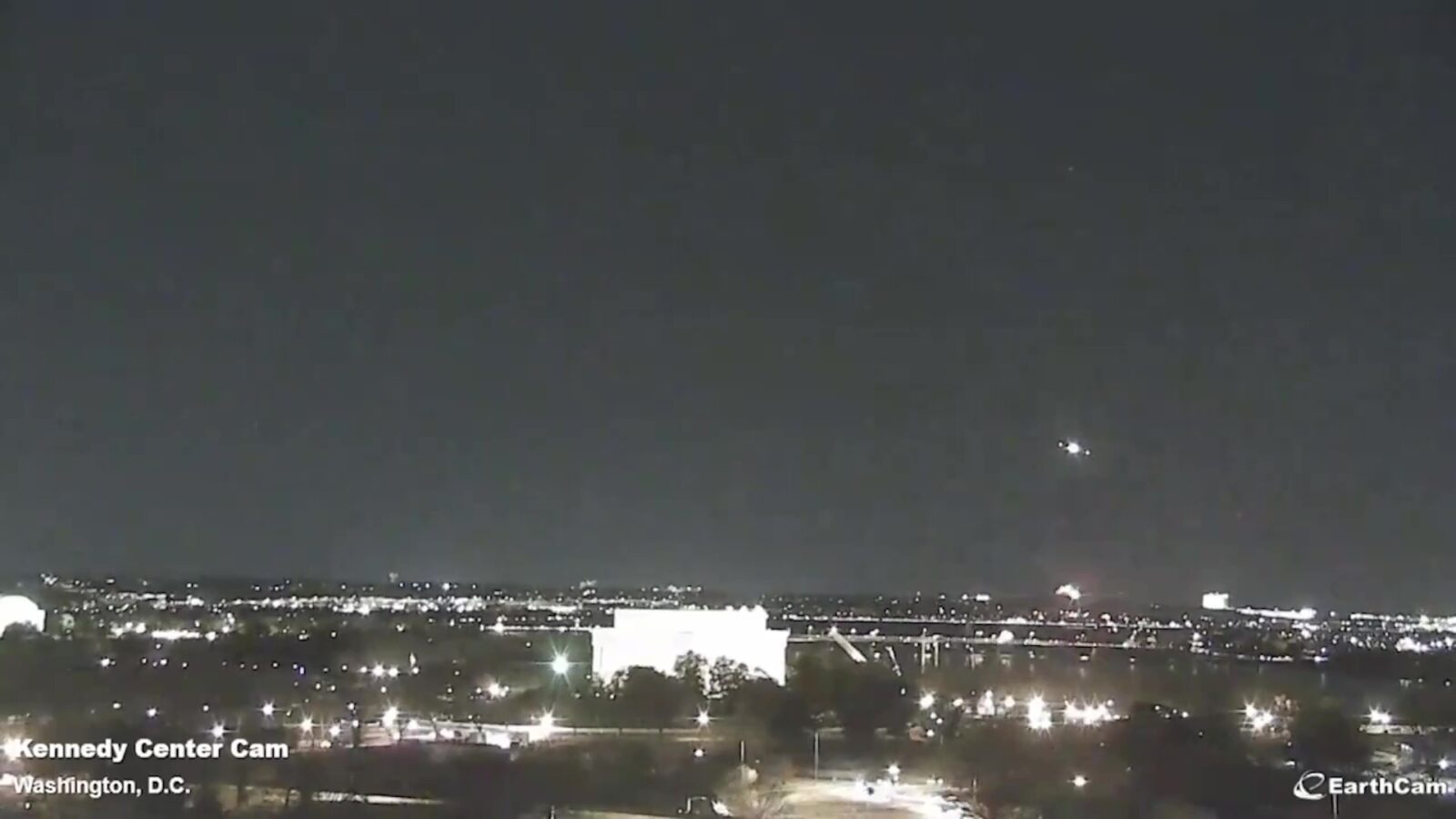 A screen grab captured from a video shows a regional plane collided in midair with a military helicopter and crashed into the Potomac River in Washington, D.C. United States, Jan. 29, 2025. (Kennedy Center Cam - Anadolu Agency)