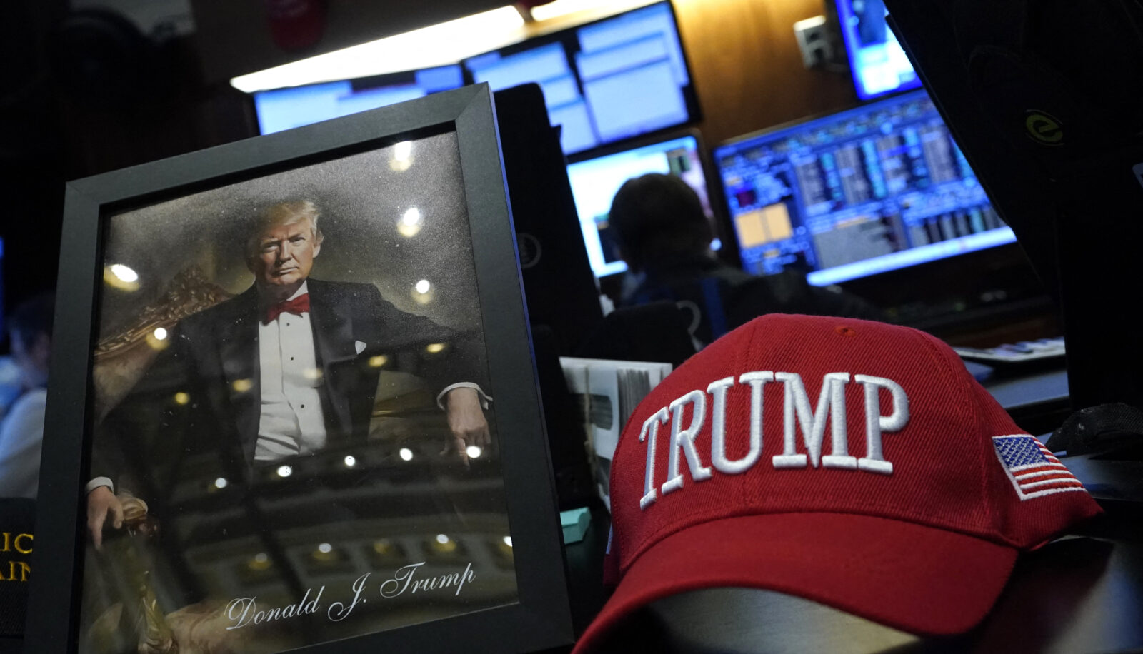 President elect Donald Trump items on display as traders and financial professionals work on the floor of the New York Stock Exchange (NYSE) during the first session of the new year in New York City, U.S, on Jan. 2, 2025. (AFP Photo)