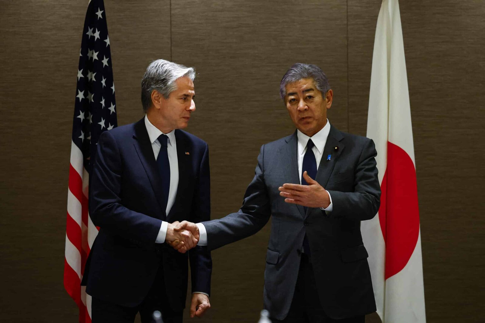 U.S. Secretary of State Antony Blinken (L) and Japanese Foreign Minister Takeshi Iwaya shake hands during a working lunch at a hotel in Tokyo, Japan, on Jan. 7, 2025. (AFP Photo)