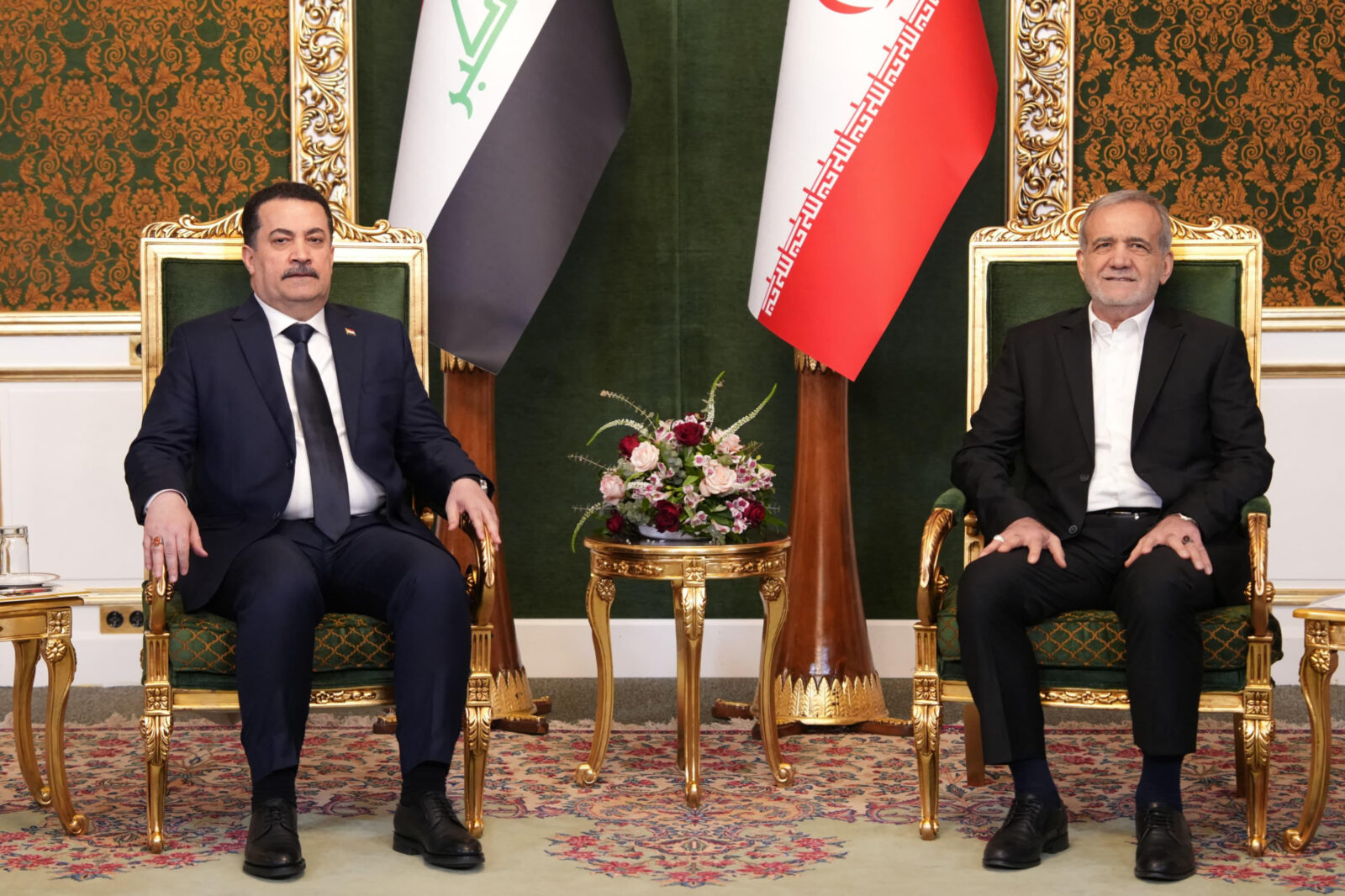 A handout picture released by Iraq's Prime Minister's Media Office on January 8, 2025, shows Iraqi Prime Minister Mohammed Shia al-Sudani (L) meeting with Iran's President Masoud Pezeshkian, in Tehran. (AFP Photo)