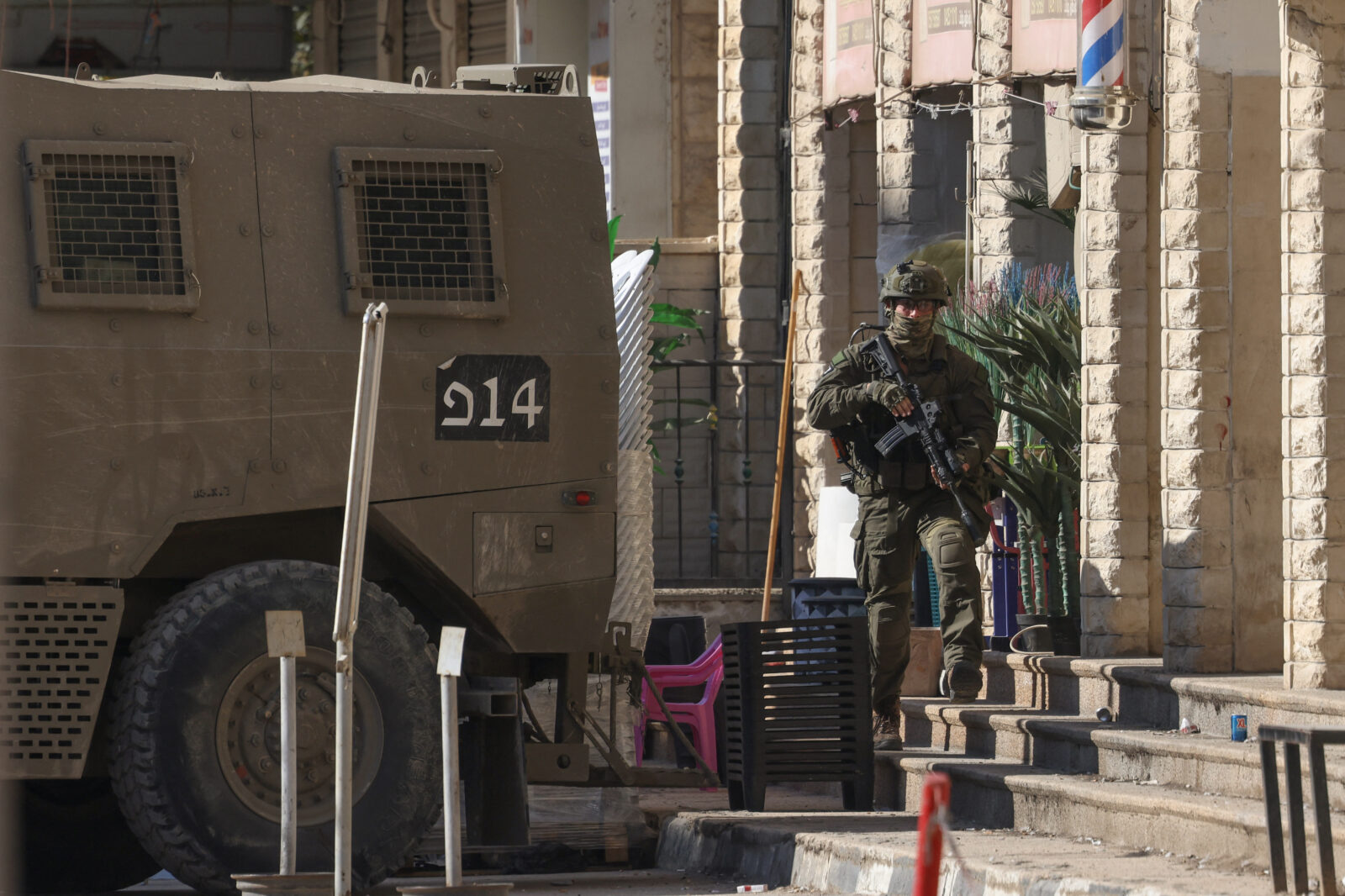 An Israeli soldier walks during a raid in the Palestinian village of Qabatiyah, in the north of the occupied West Bank, on Jan. 10, 2025. (AFP Photo)