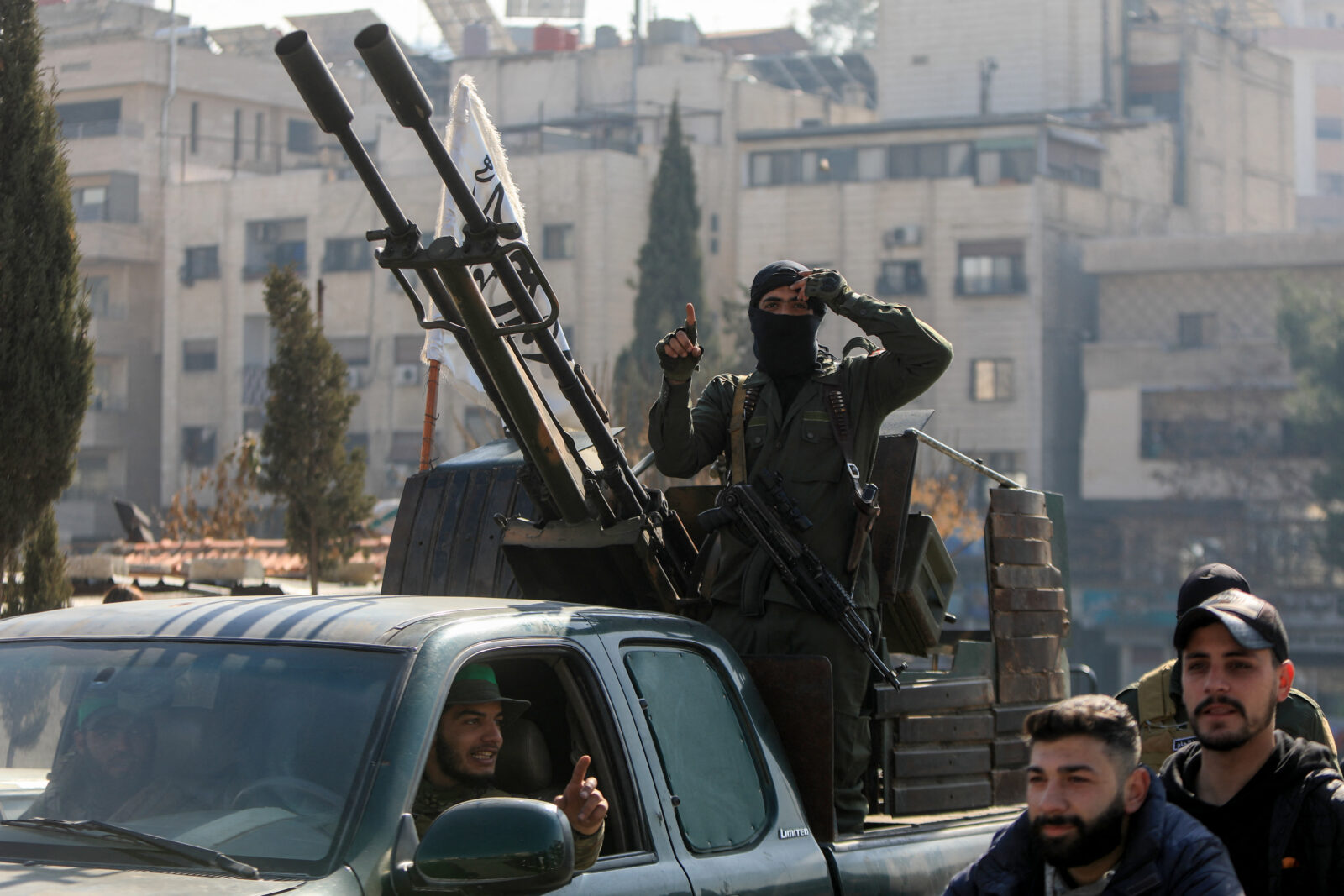 Security forces reporting to Syria's transitional government patrol the streets of Dummar, a suburb of the Syrian capital Damascus, during an operation to seize weapons and hunt down armed supporters of the ousted Assad leadership on Jan. 15, 2025. (AFP Photo)