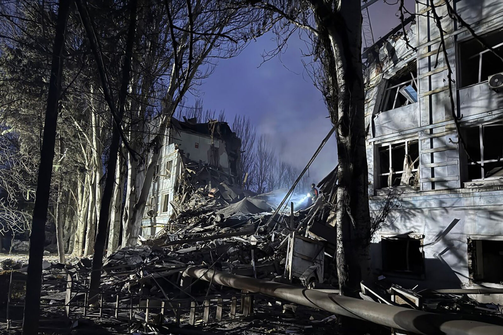This handout photograph taken and released by the National Police of Ukraine on Jan. 18, 2025, shows a building destroyed as a result of a rocket attack in Zaporizhzhia, amid the Russian invasion of Ukraine. (AFP Photo)