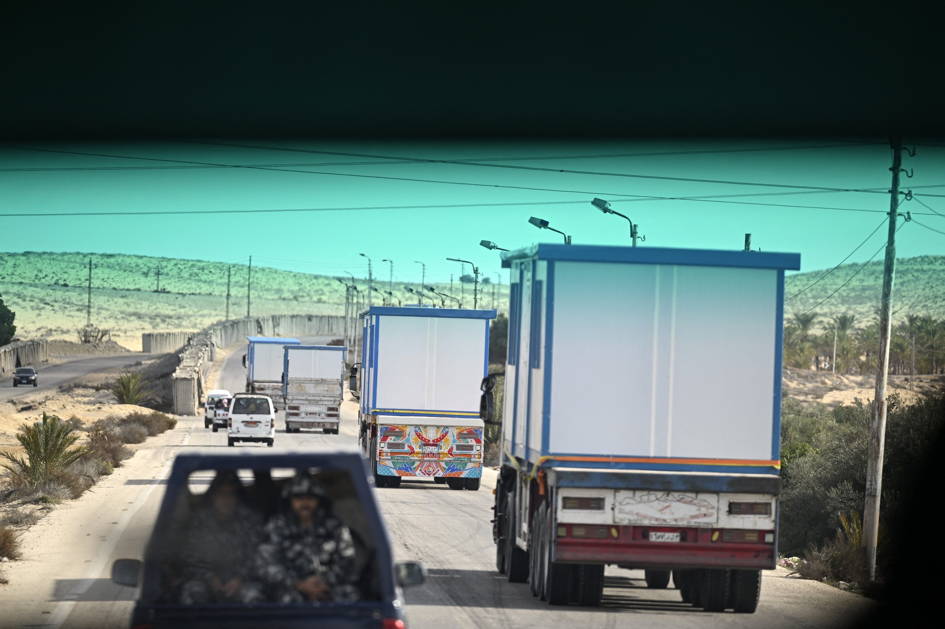 Aid trucks prepare to enter war-torn Gaza as ceasefire begins