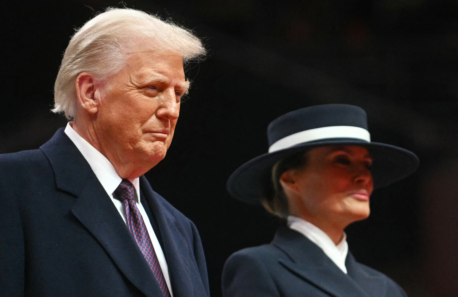 US President Donald Trump and First Lady Melania Trump watch bands perform during the inaugural parade inside Capital One Arena, in Washington, DC, on Jan. 20, 2025. (AFP Photo)