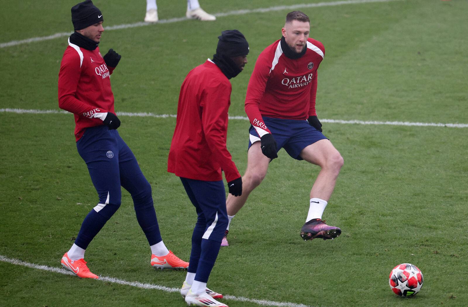 Paris Saint-Germain's Slovak defender #37 Milan Skriniar (R) fights for the ball with Paris Saint-Germain's French defender #21 Lucas Hernandez (L) and Paris Saint-Germain's French forward #10 Ousmane Dembele during a training session on the eve of the UEFA Champions League football match against Manchester City at the Campus Paris Saint-Germain in Poissy western Paris, on Jan. 21, 2025. (AFP Photo)