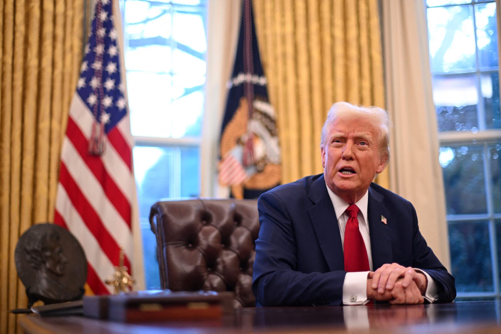 US President Donald Trump speaks to journalists in the Oval Office of the White House in Washington, DC, on January 30, 2025. (AFP Photo)