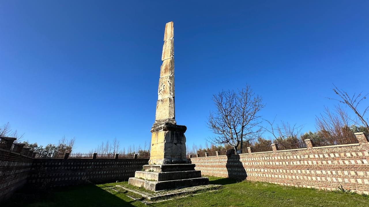 A 2,000-year-old Roman-era tomb monument, the obelisk in Iznik, Bursa, stands amidst peach orchards, Türkiye, Jan. 21, 2025. (IHA Photo)