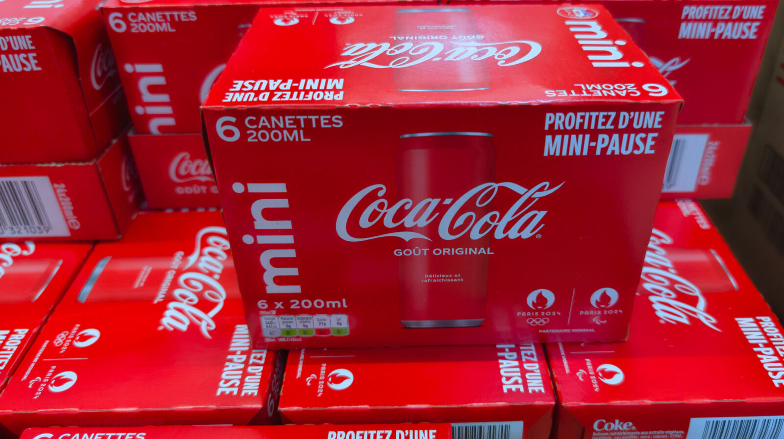 The file photo shows packs of Coca-Cola Mini cans displayed for sale in a French supermarket. (Adobe Stock Photo)