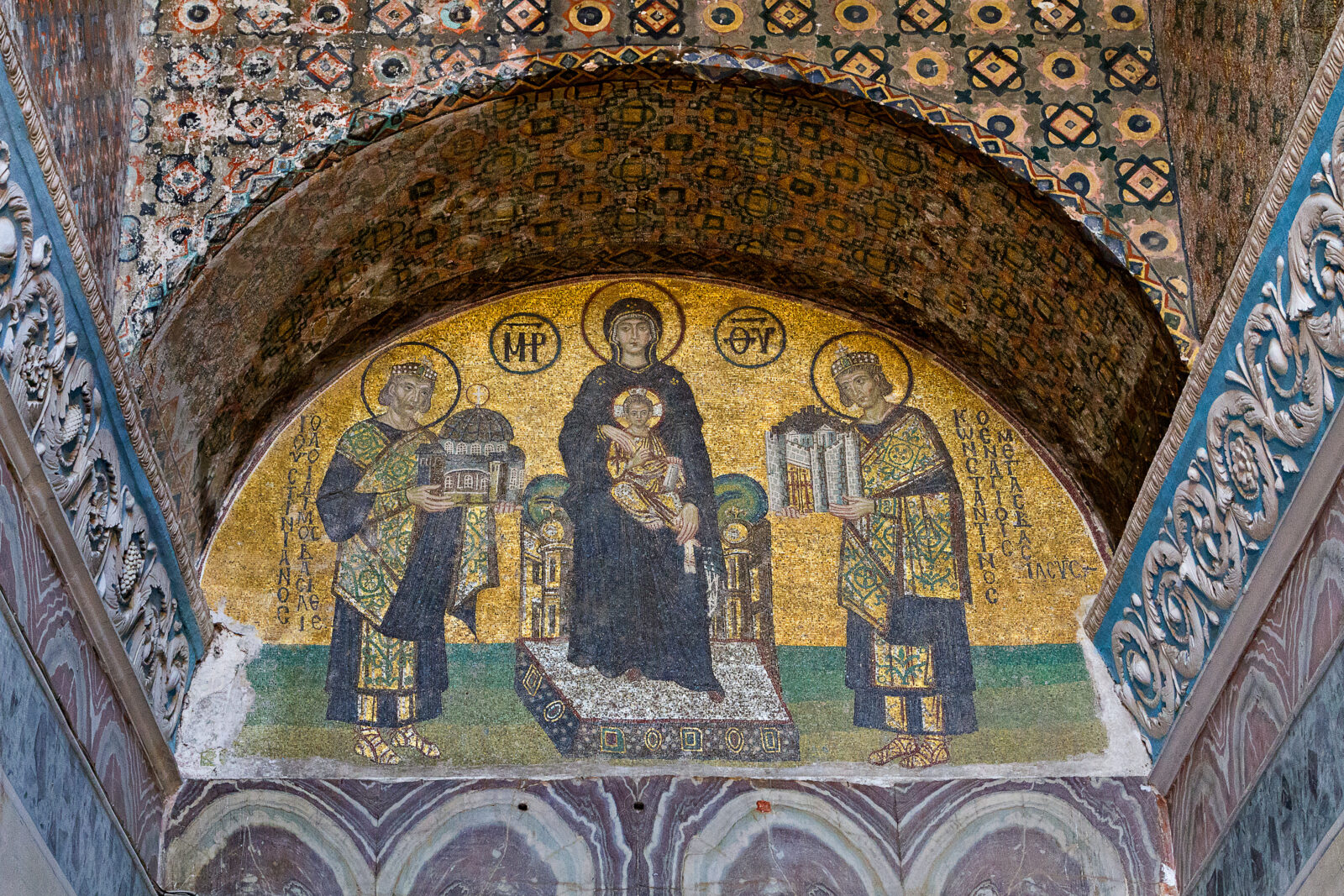A 10th-century mosaic in Hagia Sophia depicting Constantine and Iustinian presenting offerings to the Virgin Mary and her son, Jesus, in <a href=