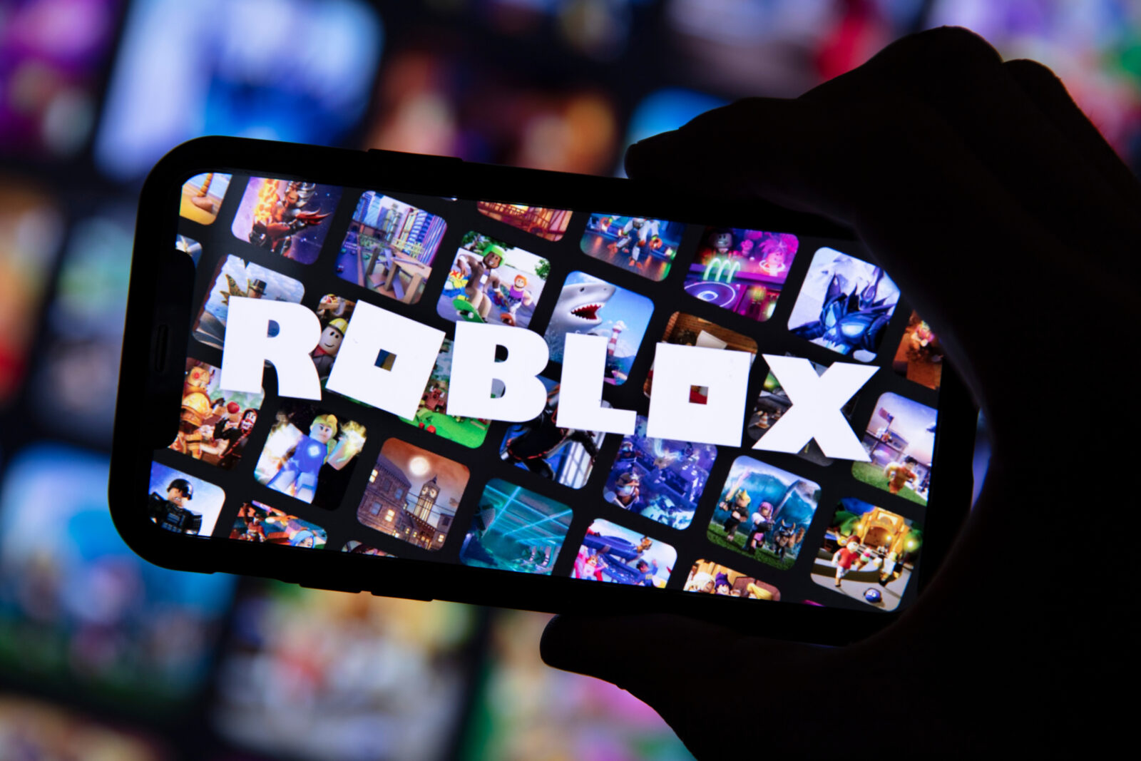 Person seen holding a smartphone with the Roblox game logo, accessed Jan. 31, 2025. (Adobe Stock Photo)