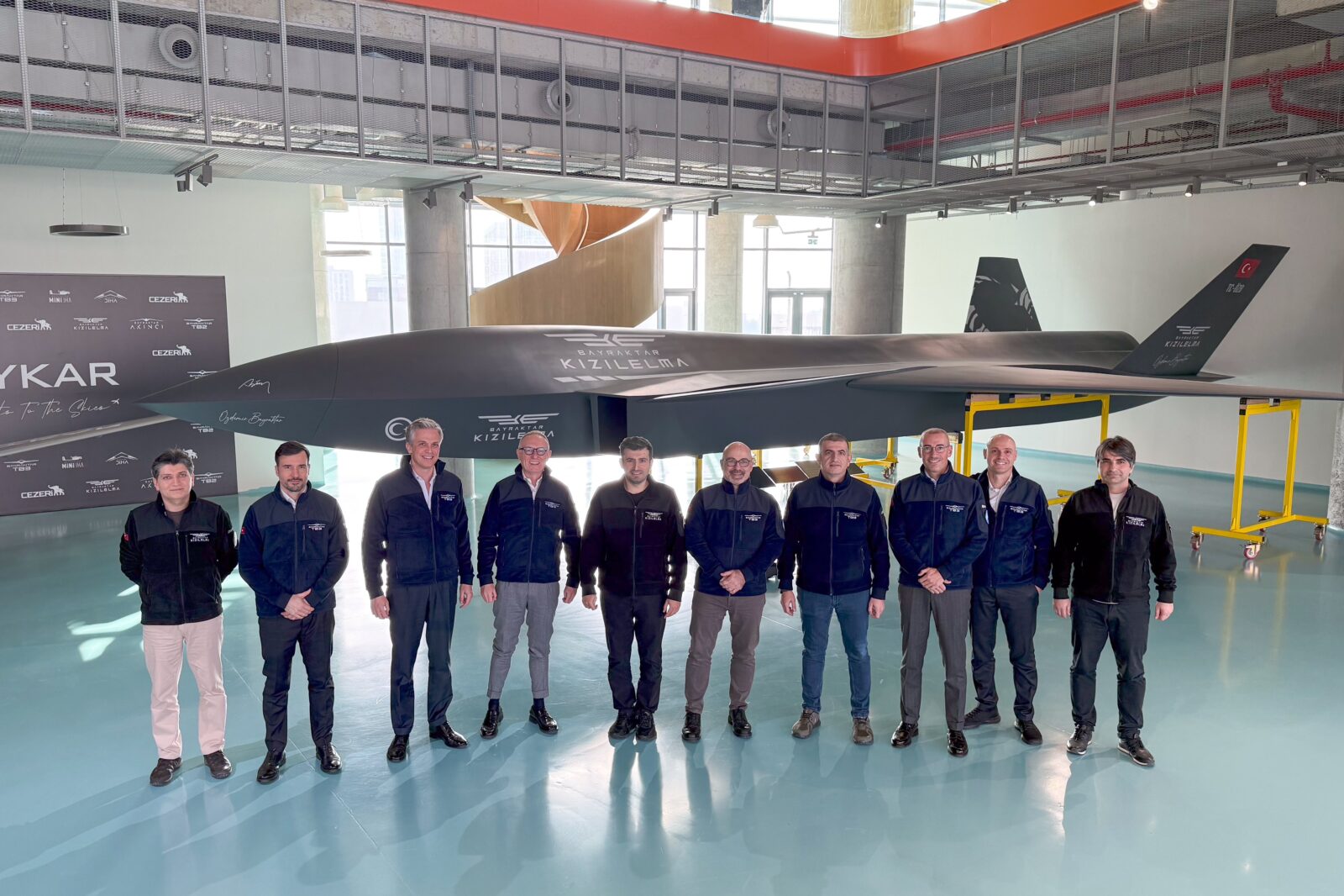 Roberto Cingolani (L), chief executive officer (CEO) of Leonardo, Italy's leading aerospace and defense industry company and Baykar Chairman Selcuk Bayraktar (R) in front of Kizilelma UCAV. (Photo via X / @BaykarTech)