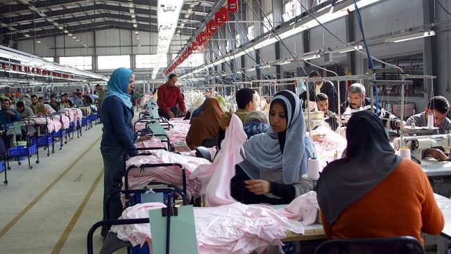 File photo shows workers at a textile factory focused on garment production in Egypt. (photo via dailynewsegypt.com)