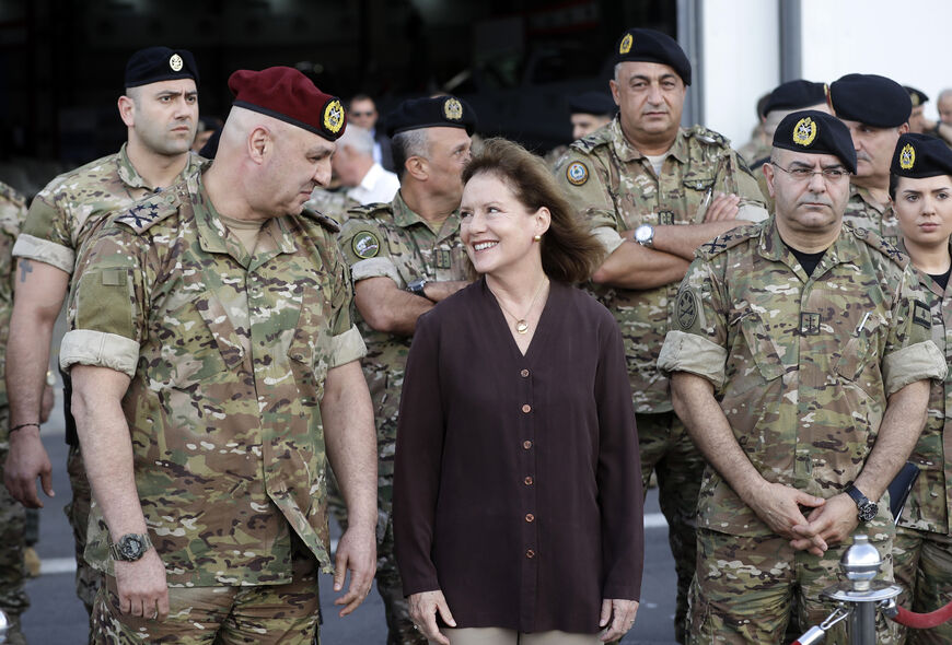 Elizabeth Richards (C), the US Ambassador to Lebanon, speaks with Lebanese Army Chief of Staff General Joseph Aoun (L) as they attend a handover ceremony organised by the Lebanese Armed Forces of four A-29 Super Tucano aircraft given by the US at Hamat airbase, north of Beirut on June 12, 2018. (AFP Photo)