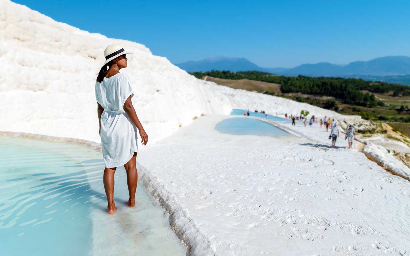 Woman in Natural travertine pools and terraces in Pamukkale, Türkiye. (Photo via X)