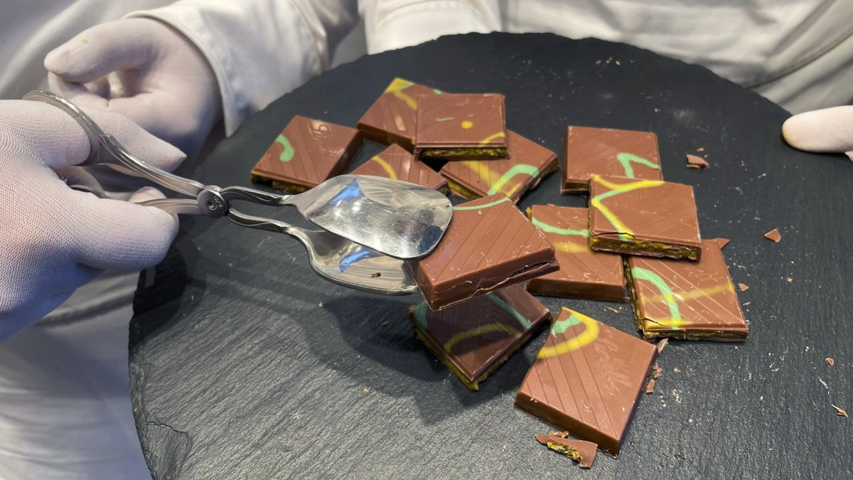 Employees at Lindt shops offering 'Dubai Chocolate' to customers during the sale of limited-edition bars, in Aachen, Germany, Thursday, Nov. 14, 2024. (AP File Photo)