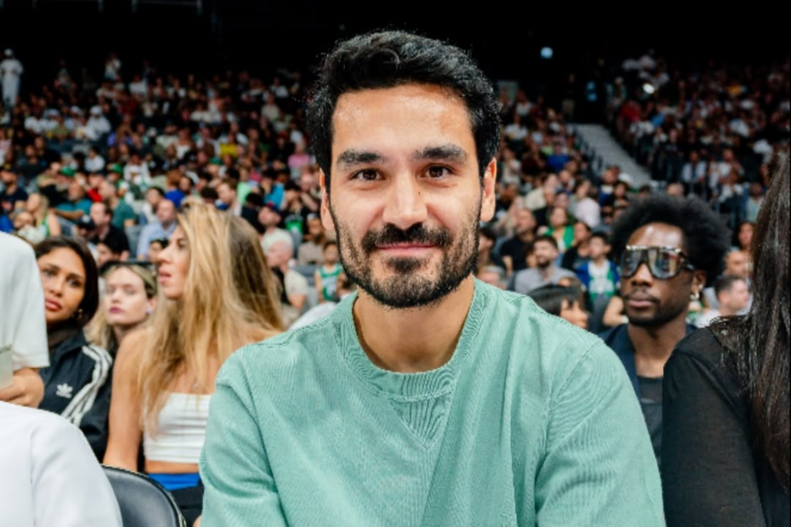 Manchester City F.C.'s Ilkay Gundogan sitting courtside at the NBA Abu Dhabi Game, United Arab Emirates, Oct. 6, 2024. (Photo via Instagram / @ilkayguendogan)