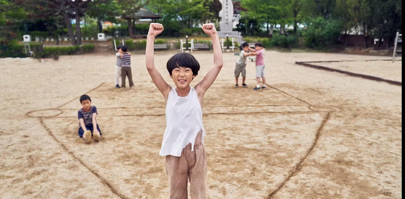 Children mimic games seen in Squid Game, raising concerns about the influence of media on their behavior, Korea, Oct. 21, 2021. (Photo via Conversation)