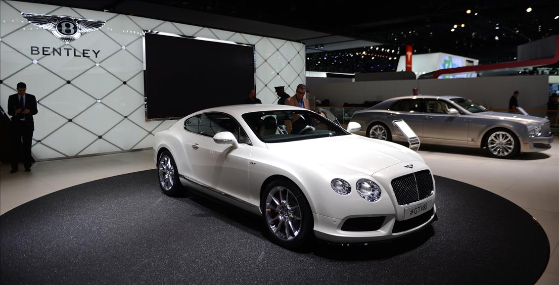 A sleek white Bentley GT V8 displayed under elegant lighting at an automotive exhibition. (AA Photo)