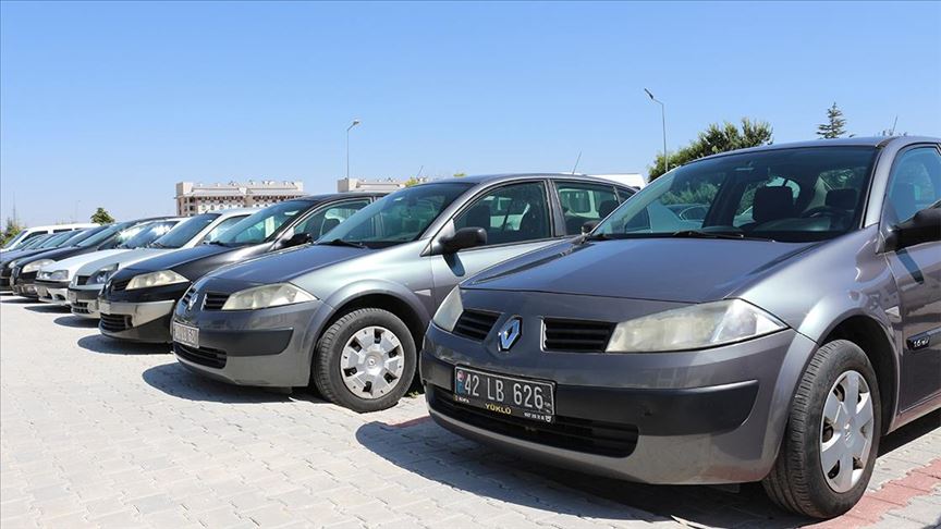 File photo shows a row of parked public passenger cars in an open parking site. (AA Photo)